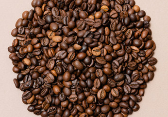 heap of coffee beans on paper background