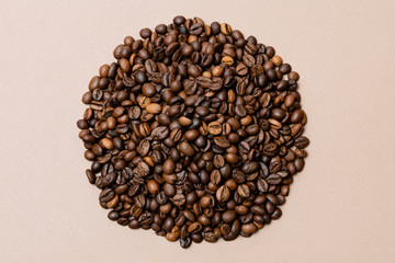 heap of coffee beans on paper background
