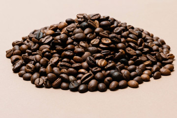 heap of coffee beans on paper background