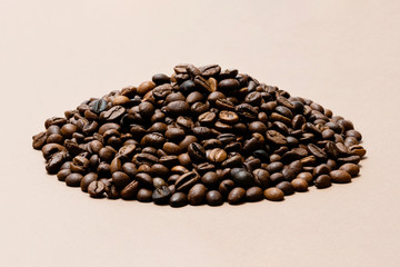 heap of coffee beans on paper background