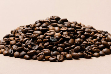 heap of coffee beans on paper background