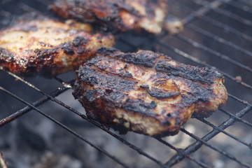 Cooking kebabs on the grill of pork steaks