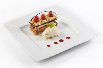Gourmet layered chocolate cake. Mousse and praline fruited cake