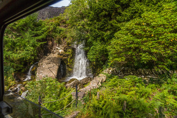 Obraz premium Waterfall taken from a carriage of the Ffestiniog Railway.