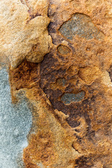 Abstract burnt orange rock formation eroding.