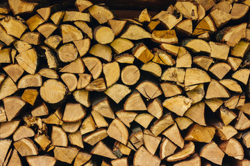 Firewood piles stacked together textured background