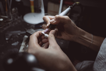 The master processes the valuable metal in the home workshop