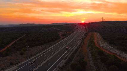 DRONE: Tourist cars speeding along the new freeway leading towards the seaside