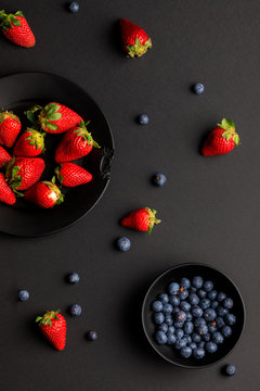 Various fresh fruits placed on black background