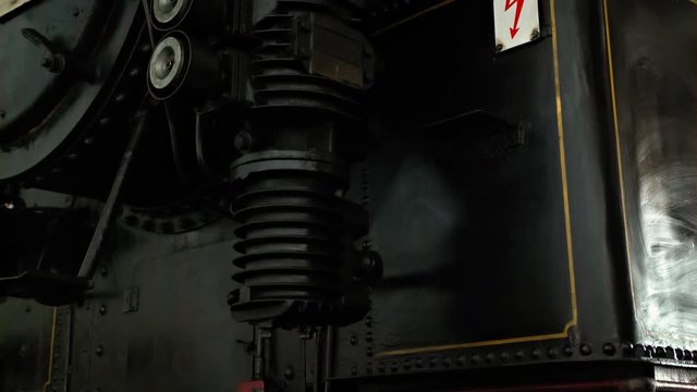 A caution sign on an old steam locomotive