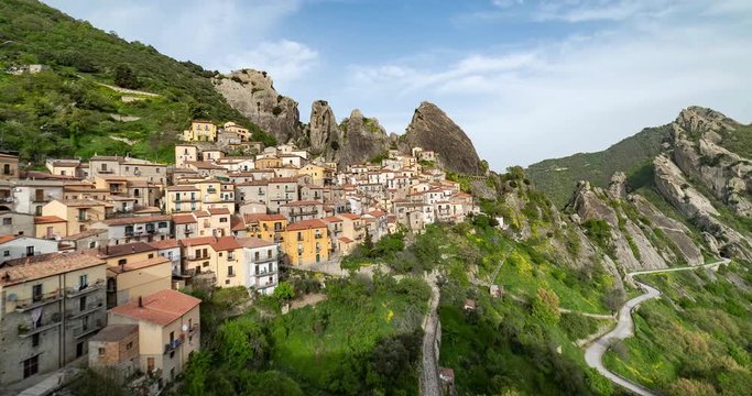 Aerial 4k overview of Castelmezzano mountain village in basilicata region, southern italy, small town with rocks on the background. time lapse video