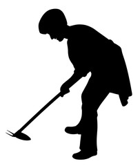 Woman working in the garden with weeding hoe