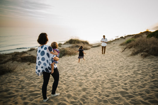 Family walking on beach