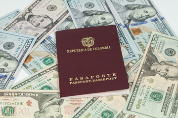 travel concept, Colombian passport with dollar bills for travel abroad