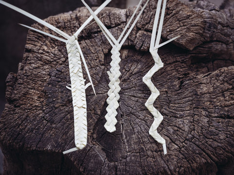 dried palm leaves fiber while working in workshop
