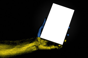 hand with painted flag Ukraine holding a large white sheet with space for an inscription, mock up