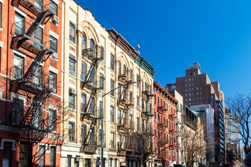 Block of colorful old buildings with clear blue sky background in the Upper East Side of Manhattan...
