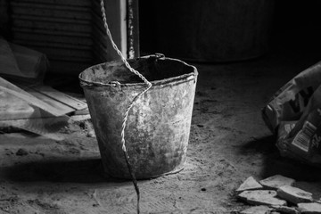 bucket with cement mortar at the construction site © Иван Сомов