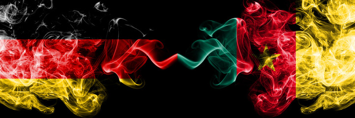 Fototapeta na wymiar Germany vs Cameroon, Cameroonian smoky mystic flags placed side by side. Thick colored silky smoke flags of Deutschland and Cameroon, Cameroonian
