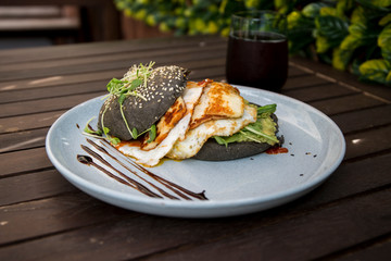 Halloumi burger with black charcoal bun