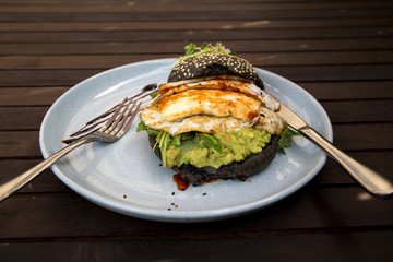 Halloumi burger with black charcoal bun