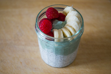 Chia pudding with matcha tea, raspberry and banana