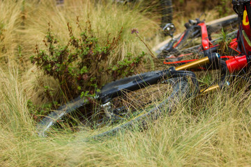 a full suspension carbon mtb bike on the grass with negative space