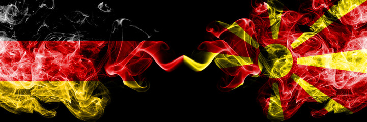 Germany vs Macedonia, Macedonian smoky mystic flags placed side by side. Thick colored silky smoke flags of Deutschland and Macedonia, Macedonian