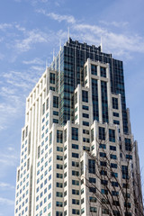 Fototapeta premium Generic office building with stepped architecture in urban area
