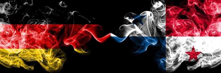 Germany vs Panama smoky mystic flags placed side by side. Thick colored silky smoke flags of Deutschland and Panama