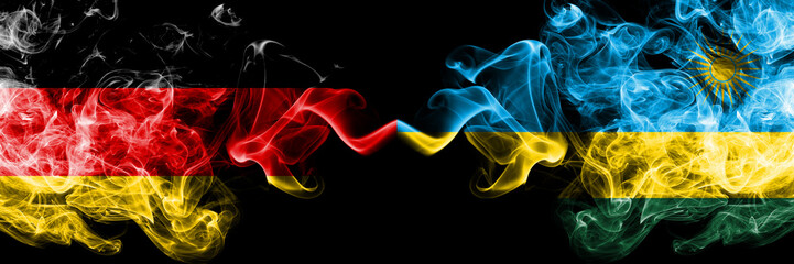 Germany vs Rwanda, Rwandan smoky mystic flags placed side by side. Thick colored silky smoke flags of Deutschland and Rwanda, Rwandan