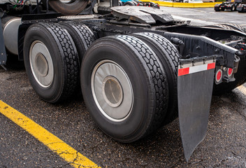 Wheelbase of big rig semi truck with two axles and pairs of wheels on them and fifth wheel for...