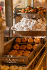 Lines of Mini Donuts Moving Out of Frying Oil