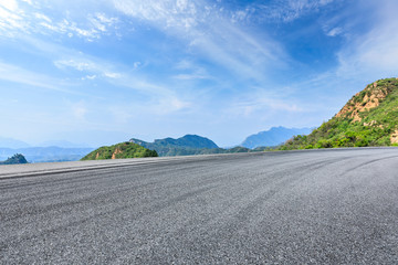 Empty asphalt race track and beautiful natural landscape