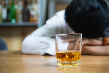 drunkard fall asleep on the table at bar.