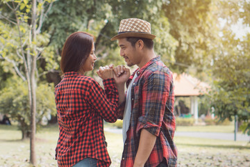 Fototapeta premium romantic asian couple dating in the park.