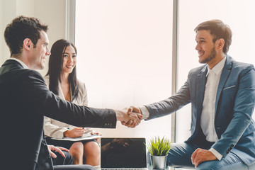 Business team casual meeting and discussing in workplace.