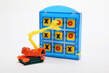 Fototapeta premium Tic Tac Toe and Toy Earthmover 