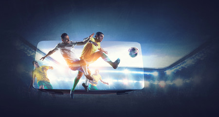 Soccer players on stadium in action and VR helmet. Mixed media © Sergey Nivens