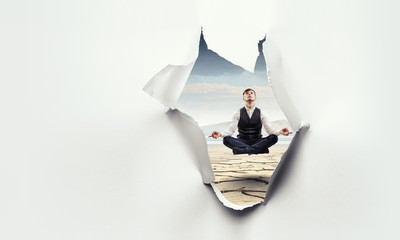 Torn paper hole effect with levitating businessman