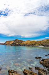 Seascape with mountain coastline and crystal clear water
