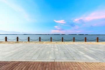 Beautiful lake and walkway with sky clouds at sunset
