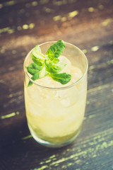 Sweet rum based cocktail with mint. Selective focus. Shallow depth of field.