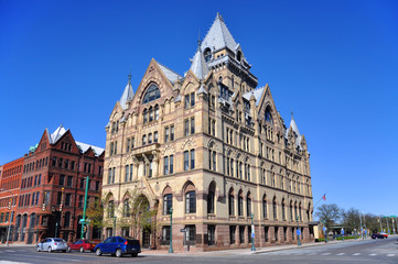 Fototapeta na wymiar Syracuse Savings Bank Building was built in 1876 with Gothic style at Clinton Square in downtown Syracuse, New York State, USA. Now this building is a US National Register of Historic Places.