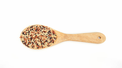 Organic three colors (red, black, and brown) parboiled rice on a white background.