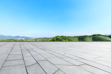 Empty square floor and green mountain natural landscape