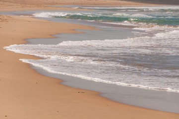 Beautiful beach background with sand and wave