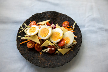 Black charcoal wrap with vegetable and egg