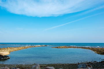 Landscape image of tropical white beach with blue sky background