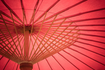 Close up details inside of traditional handmade wooden red umbrella. (Selective focus)